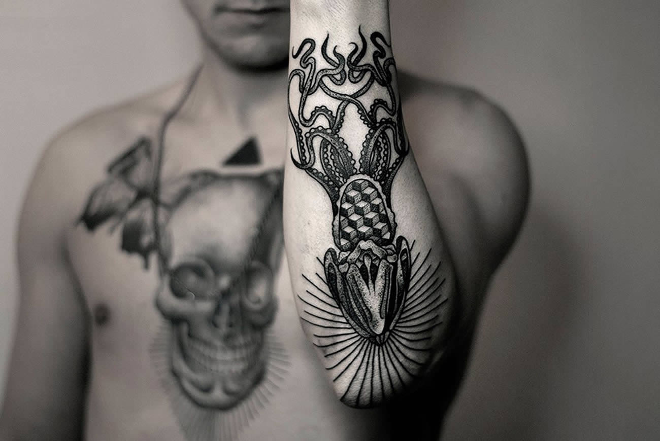 elbow blackwork tattoo by kamil czapiga