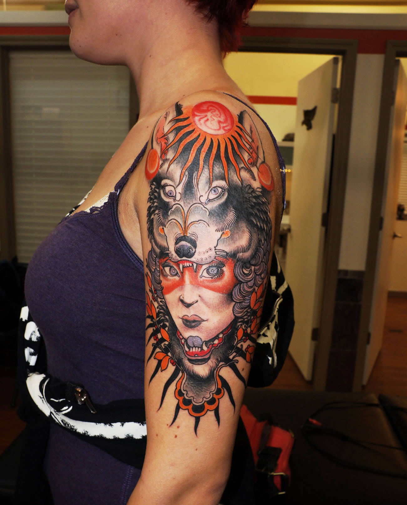 wolf head girl tattoo on arm by Matt Lambdin