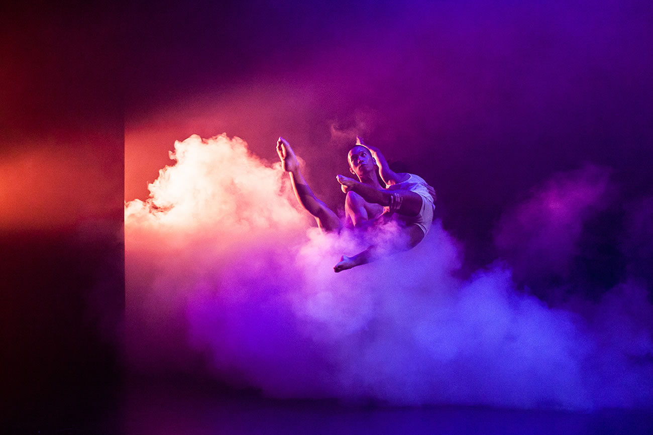 dancers, pink and purple background with smoke, photography by Lynn Lane