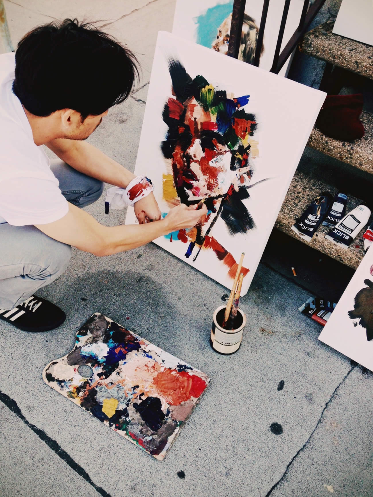 Joseph lee working on a portrait painting