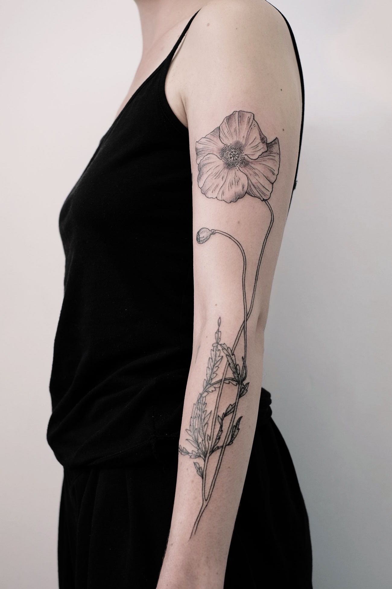 engraving style flower on arm by victor j webster