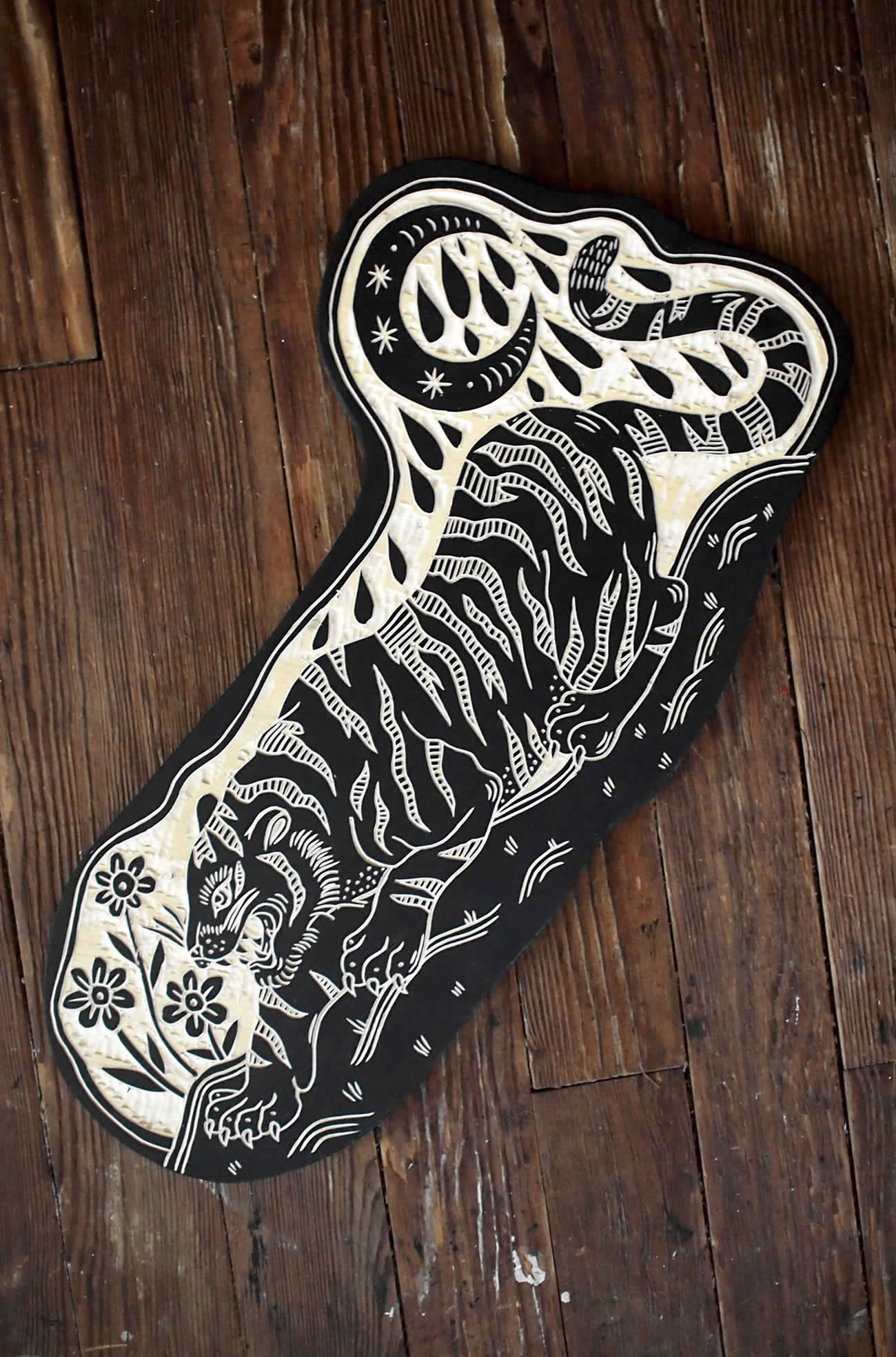 tiger going down, woodcut by bryan perrott 