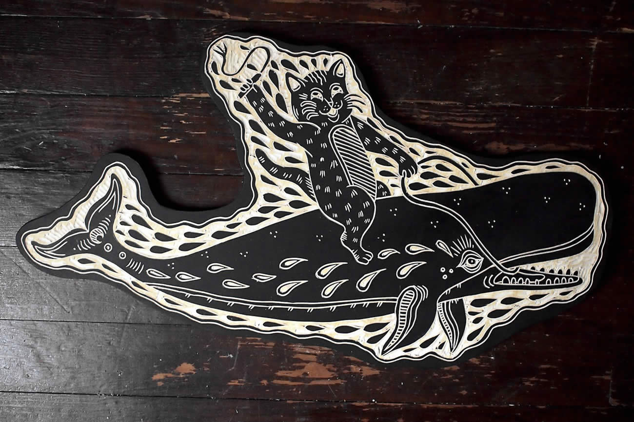 cat riding whale, woodcut by bryan perrott 