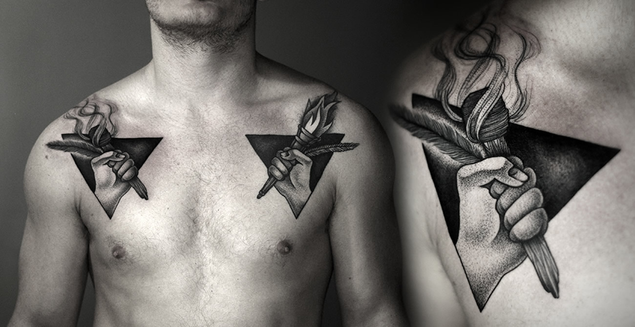 hands holding torches on chest, tattoo by Kamil Czapiga