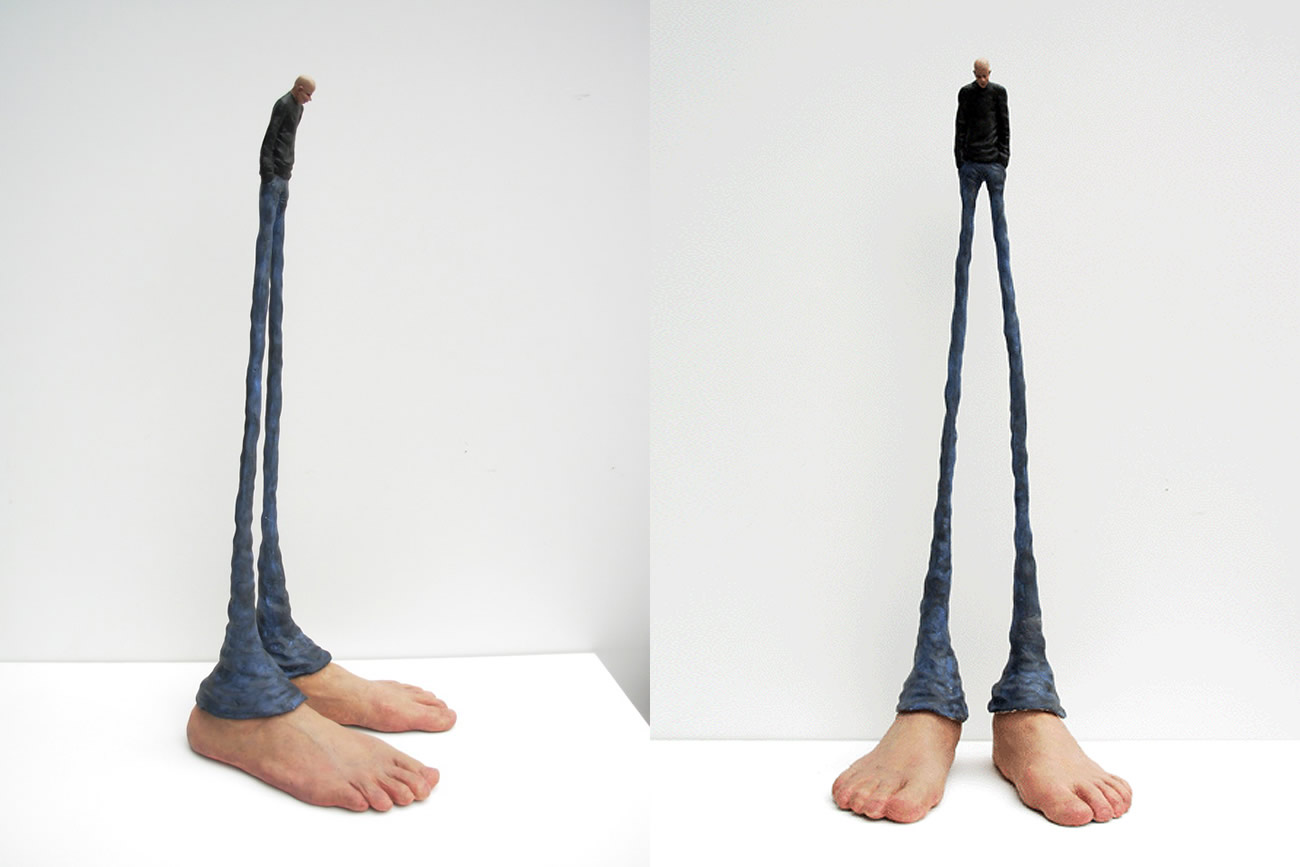 sculpture, man with giant feet by gerardo feldstein