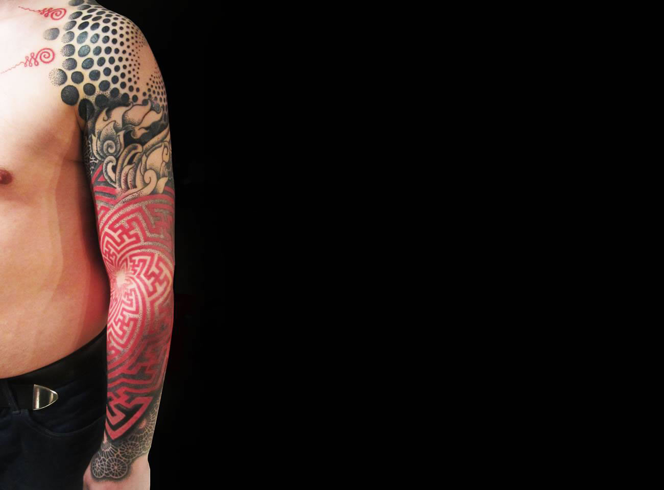 black and red arm tattoo by Karolina Czaja