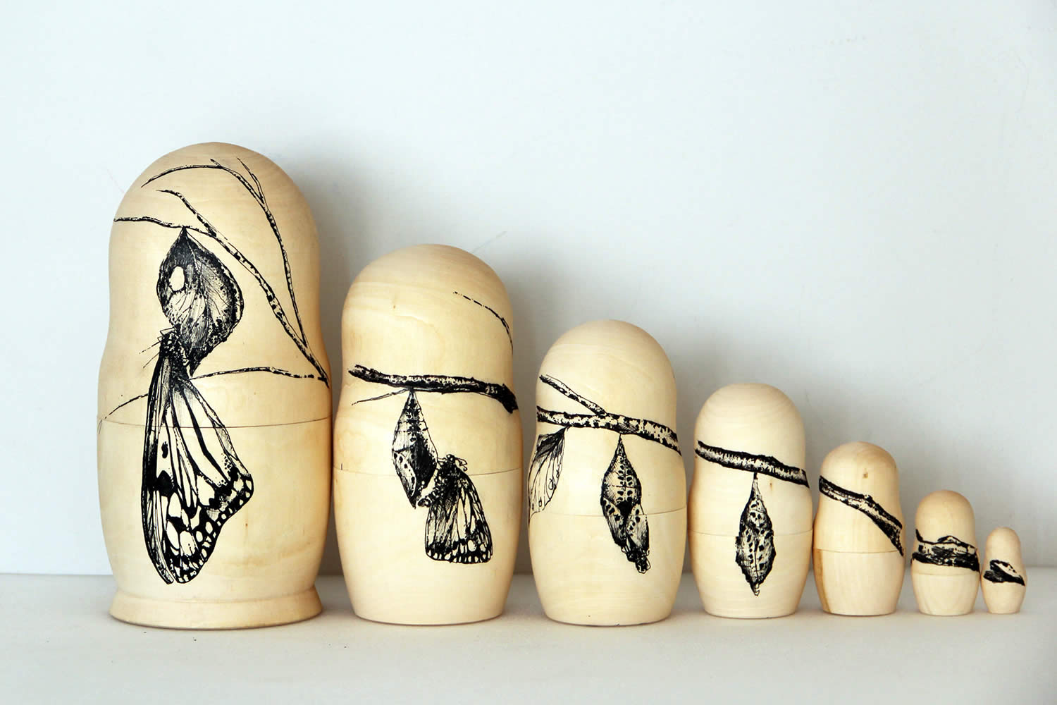 moth birth evolution, matryoshka wood by raul gutierrez