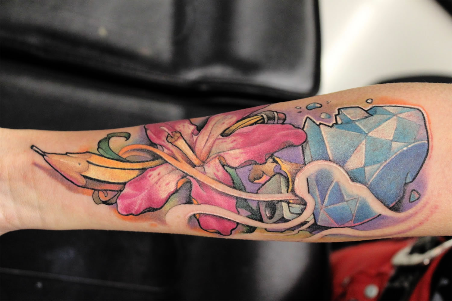 pencil with pink flower, arm tattoo by victor chil