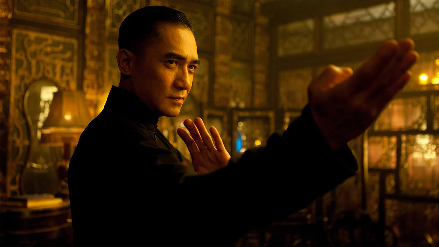 the grandmaster, fire warm scene with man ready to fight