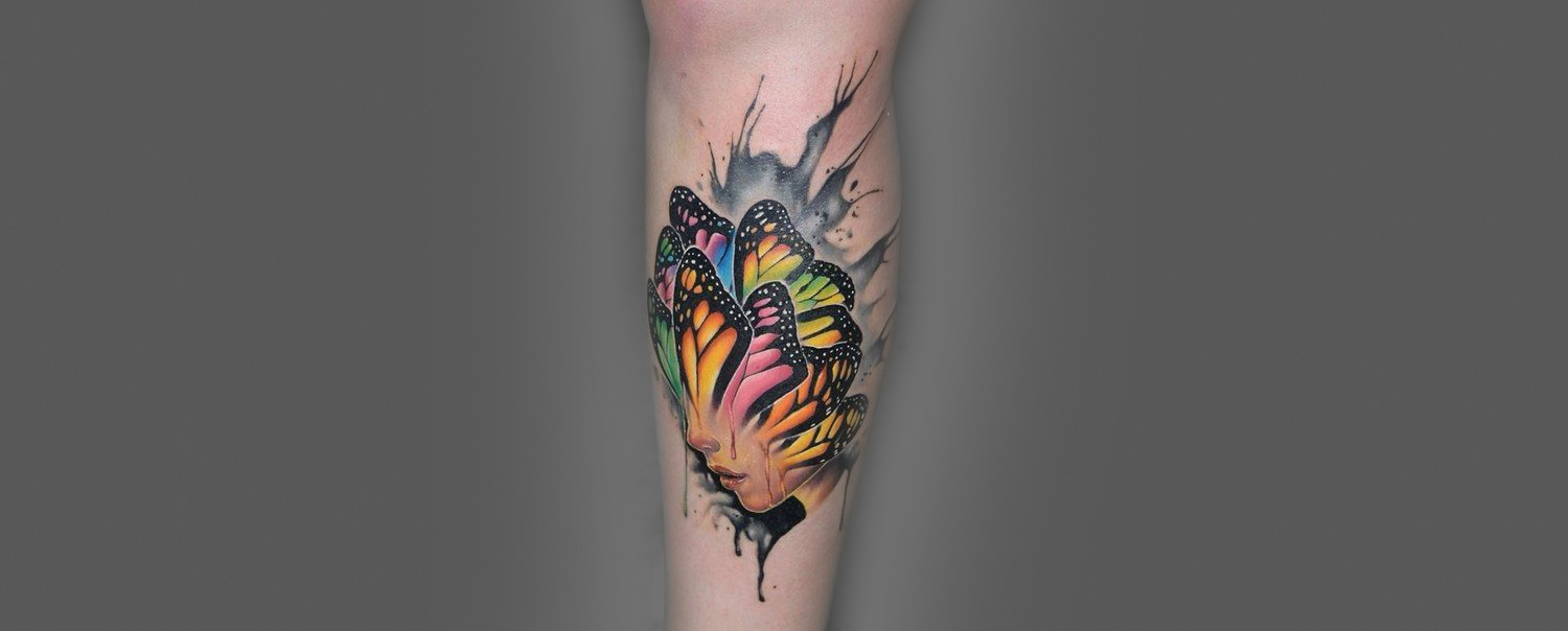 woman with butterfly head tattoo by paul vander johnson