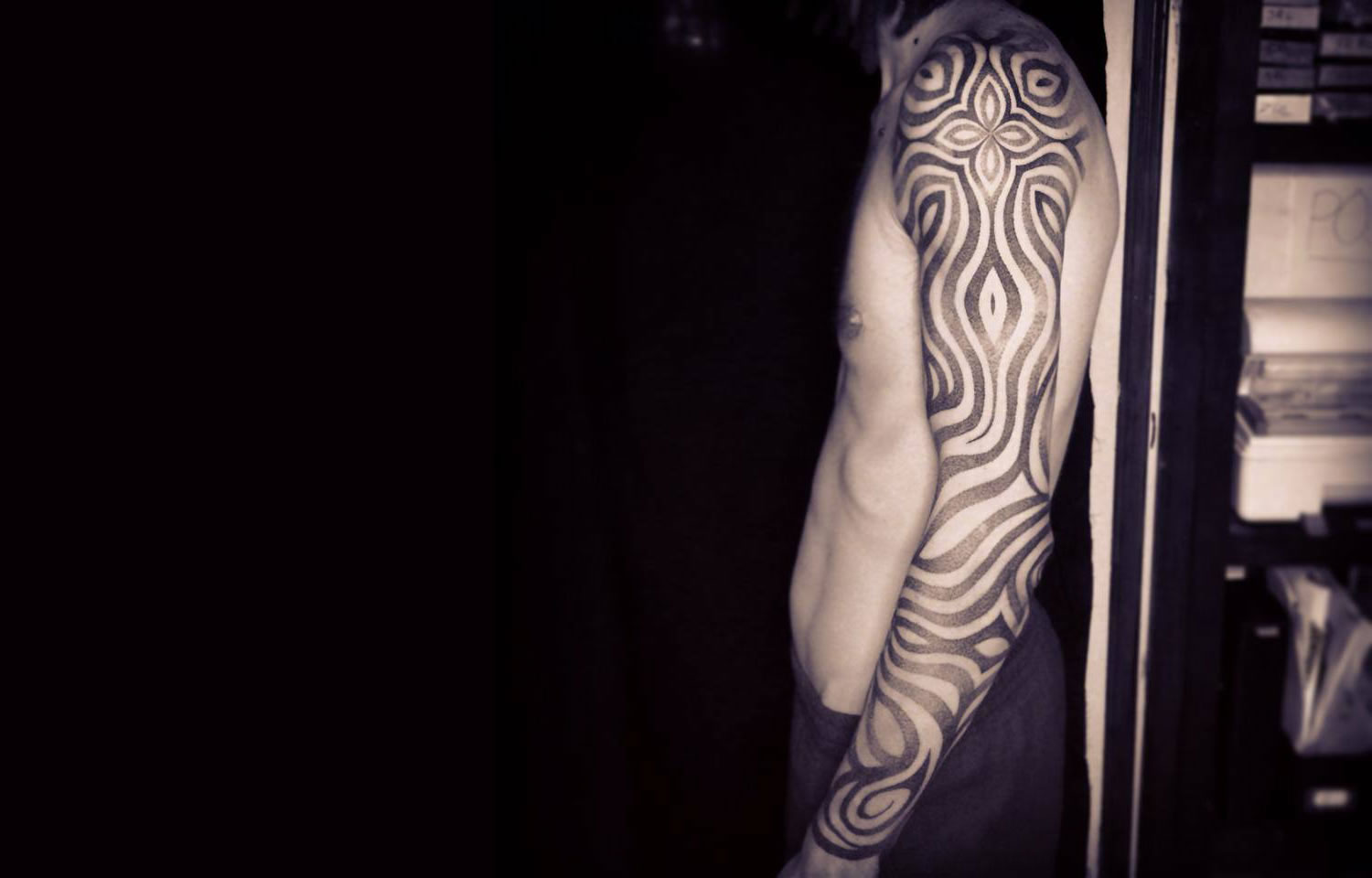 zebra patterns on arm, tattoo by jonny breeze