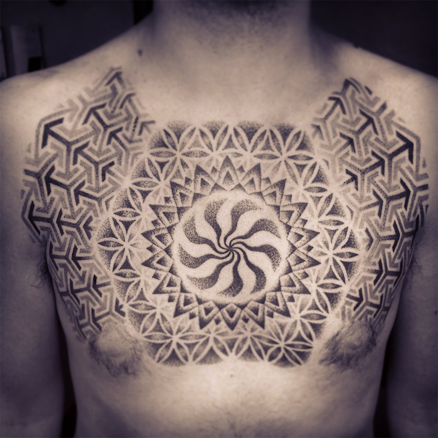 mandala style chest tattoo by jonny breeze, motion