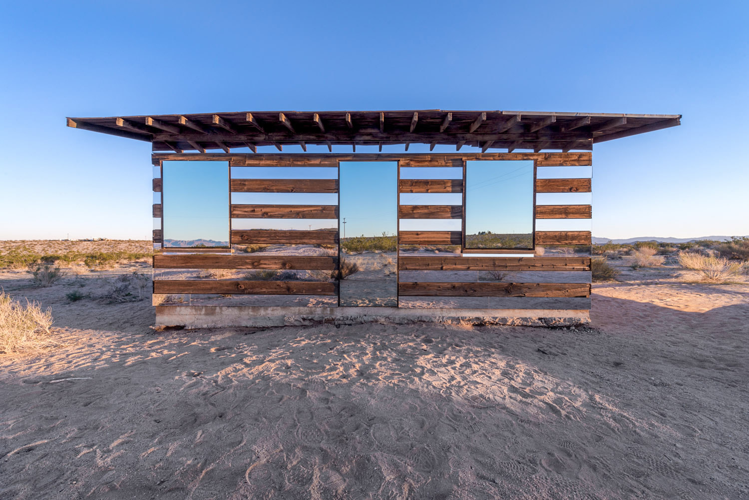 front view of lucid stead shack, mirrored, by phillip k smith