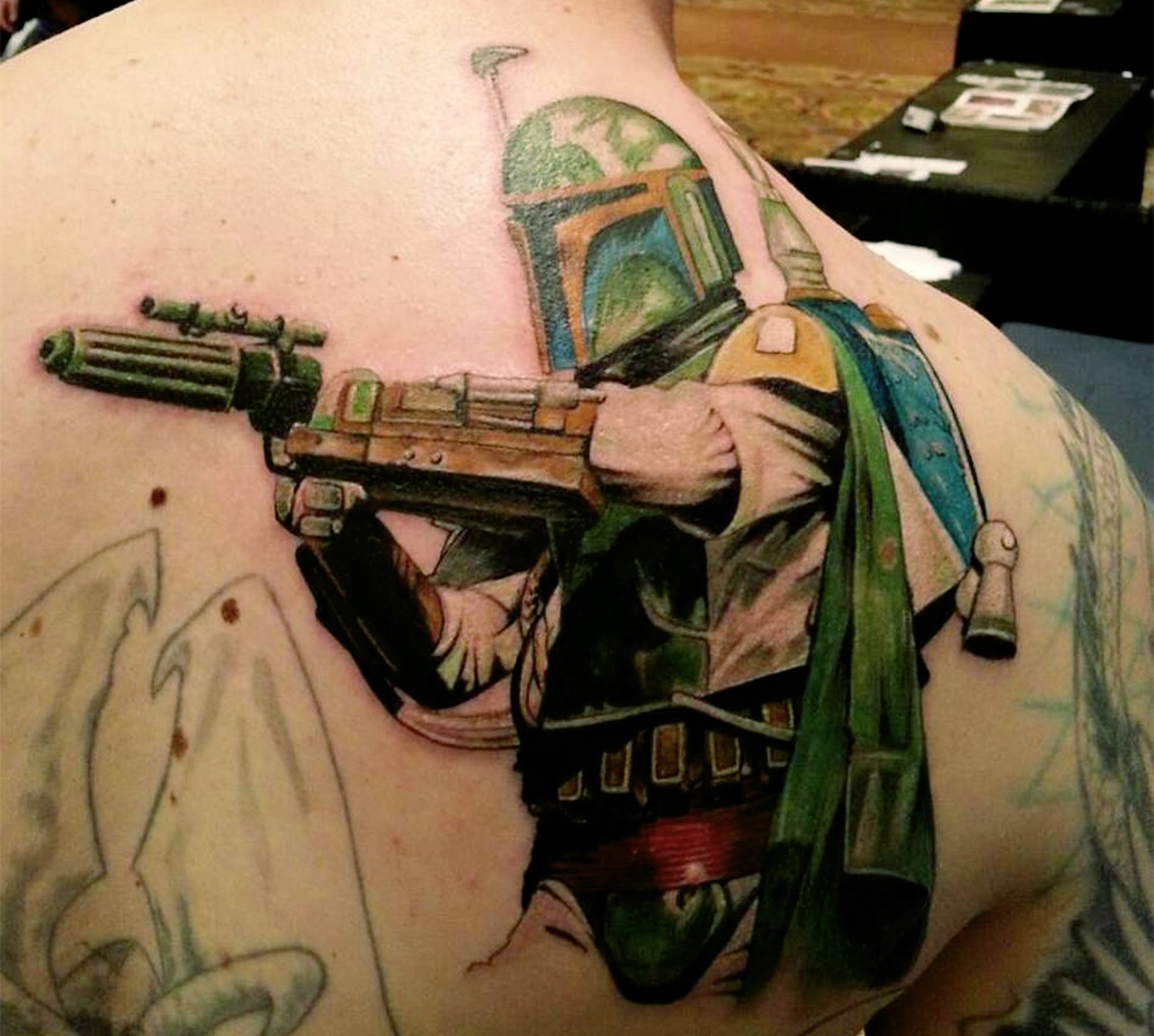 bobba fett with gun tattooed on back by chris musson, star wars