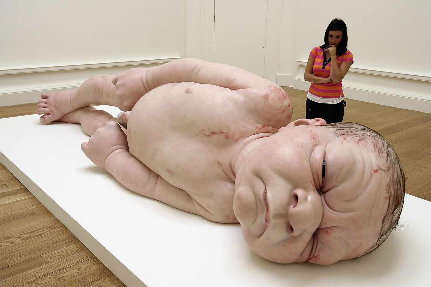 a girl by Ron Mueck, newborn baby as a hyperrealist sculpture