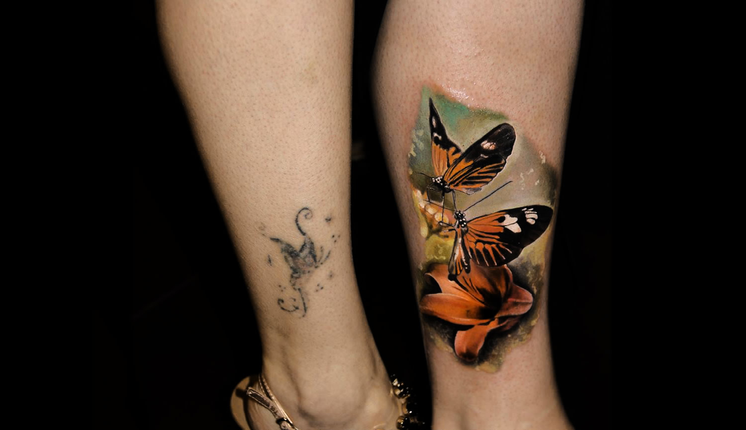 cover up tattoo, butterflies on leg by Piranha Tattoo Studios
