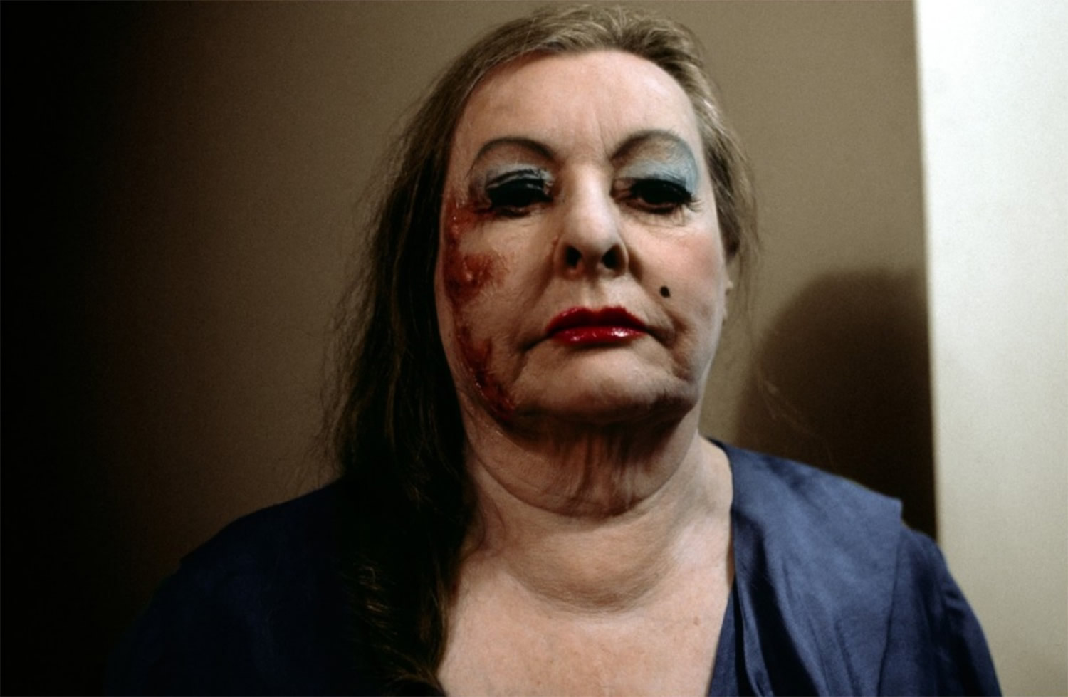 heavy makeup on woman's face in shivers, horror movie by cronenberg