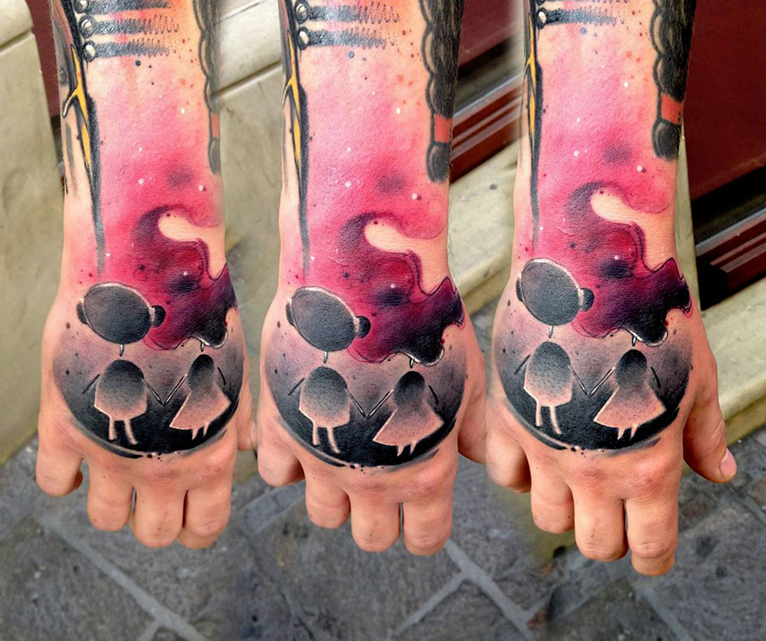 pink and black tattoo on hand and arm by Lukasz Bam Kaczmarek