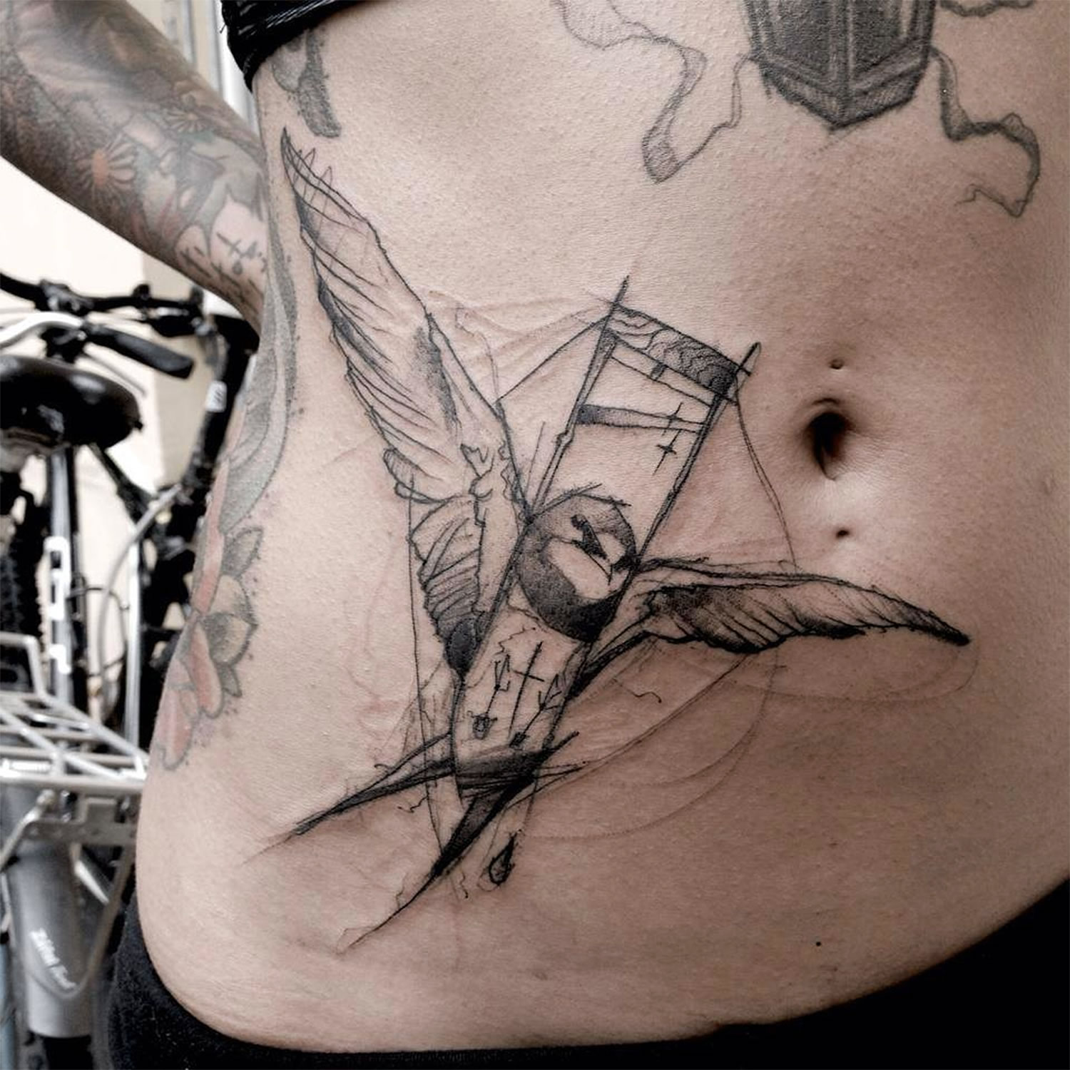 sketch-style bird tattoo by Kamil Mokot