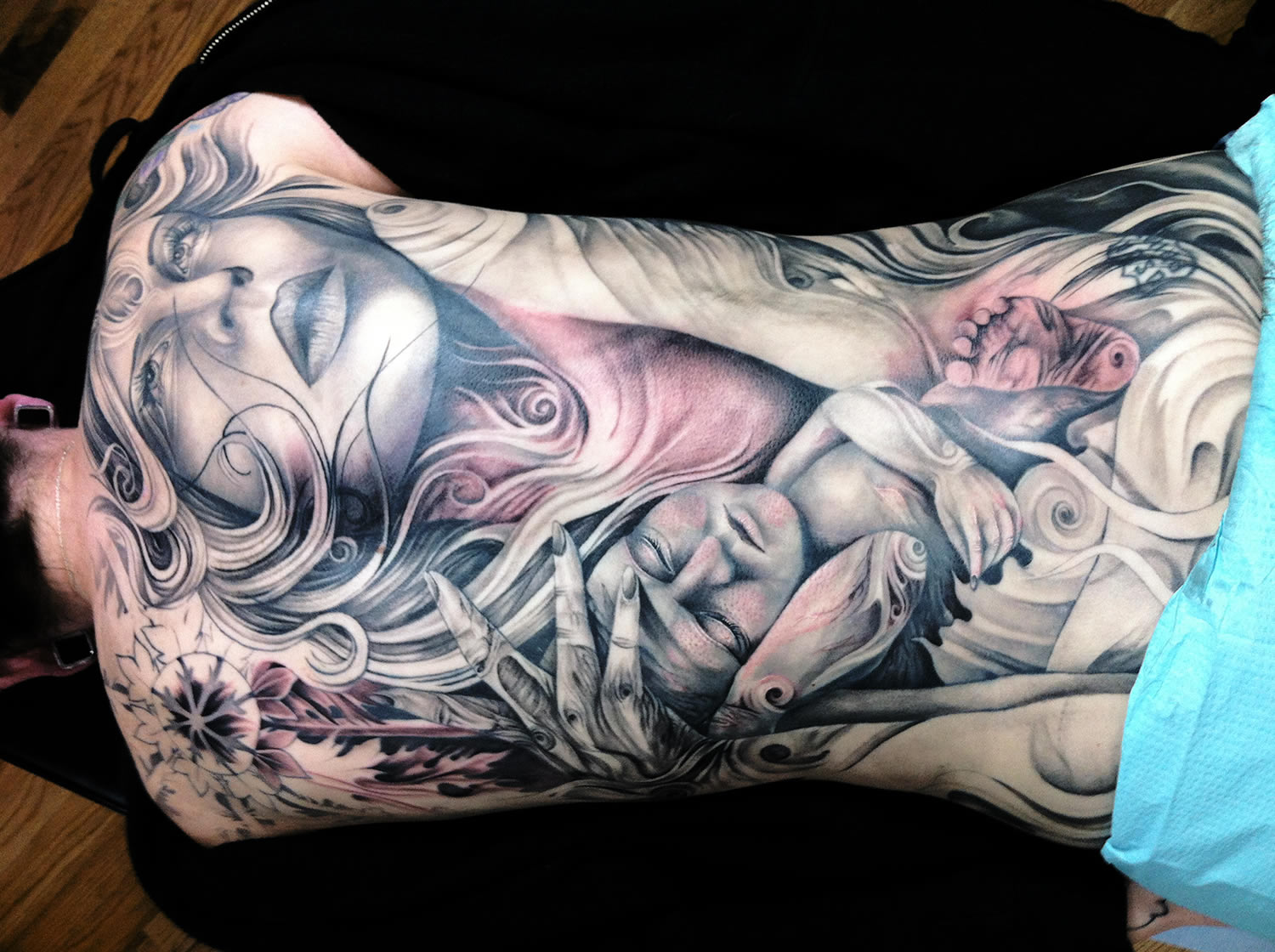 tattoo of woman and child on back, by tony mancia