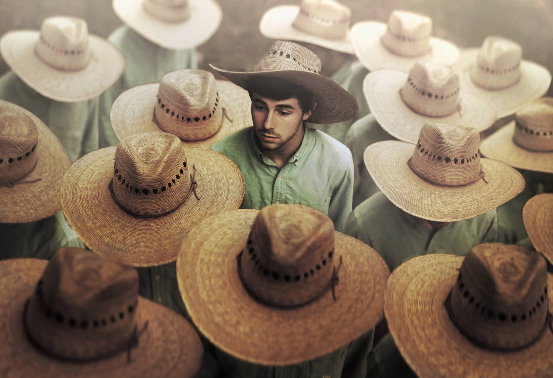 young man with hat, various men with same hat. "The Helpers" by Nicholas Scarpinato.