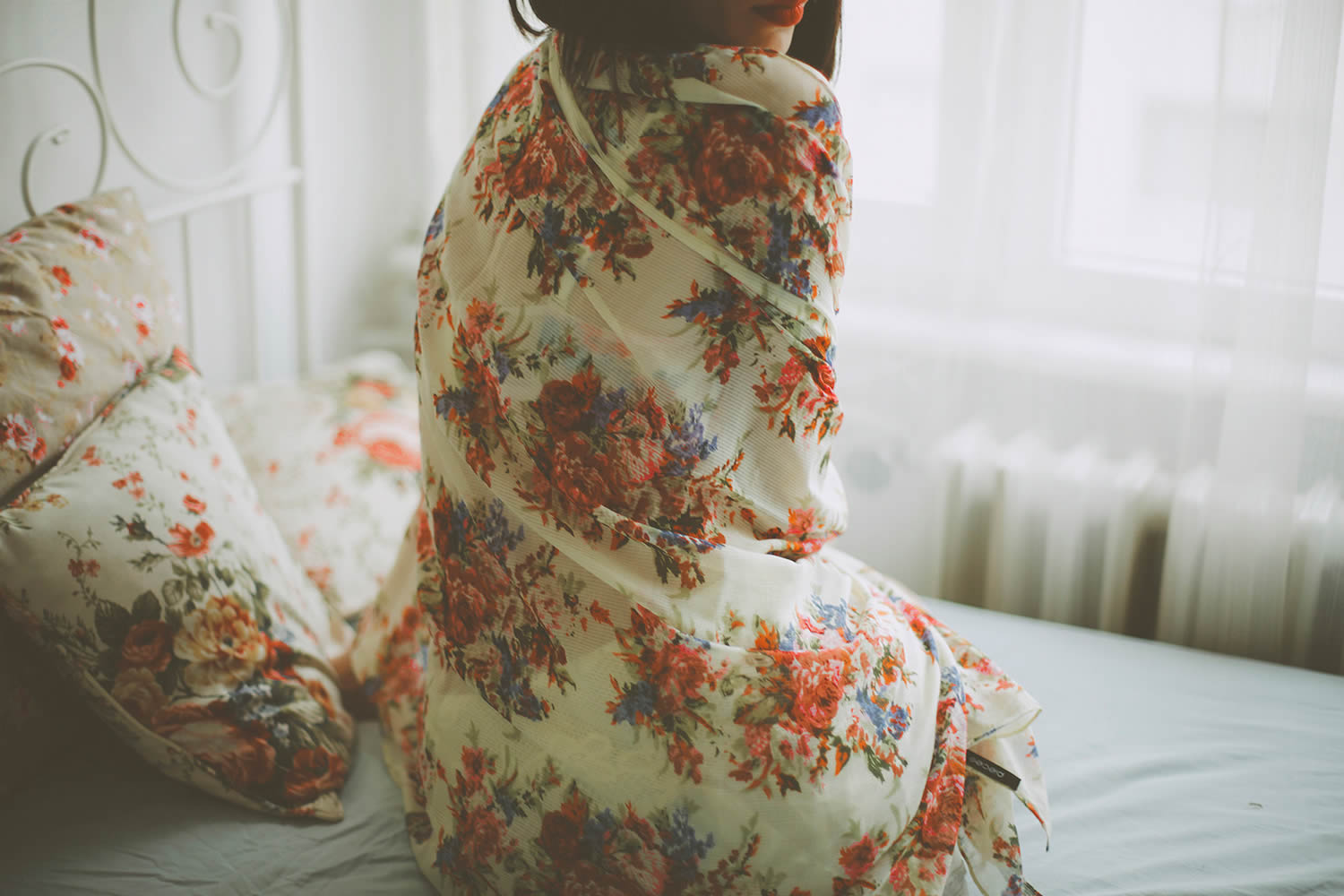girl wrapped in flowered sheets, photo by Denef Huvaj
