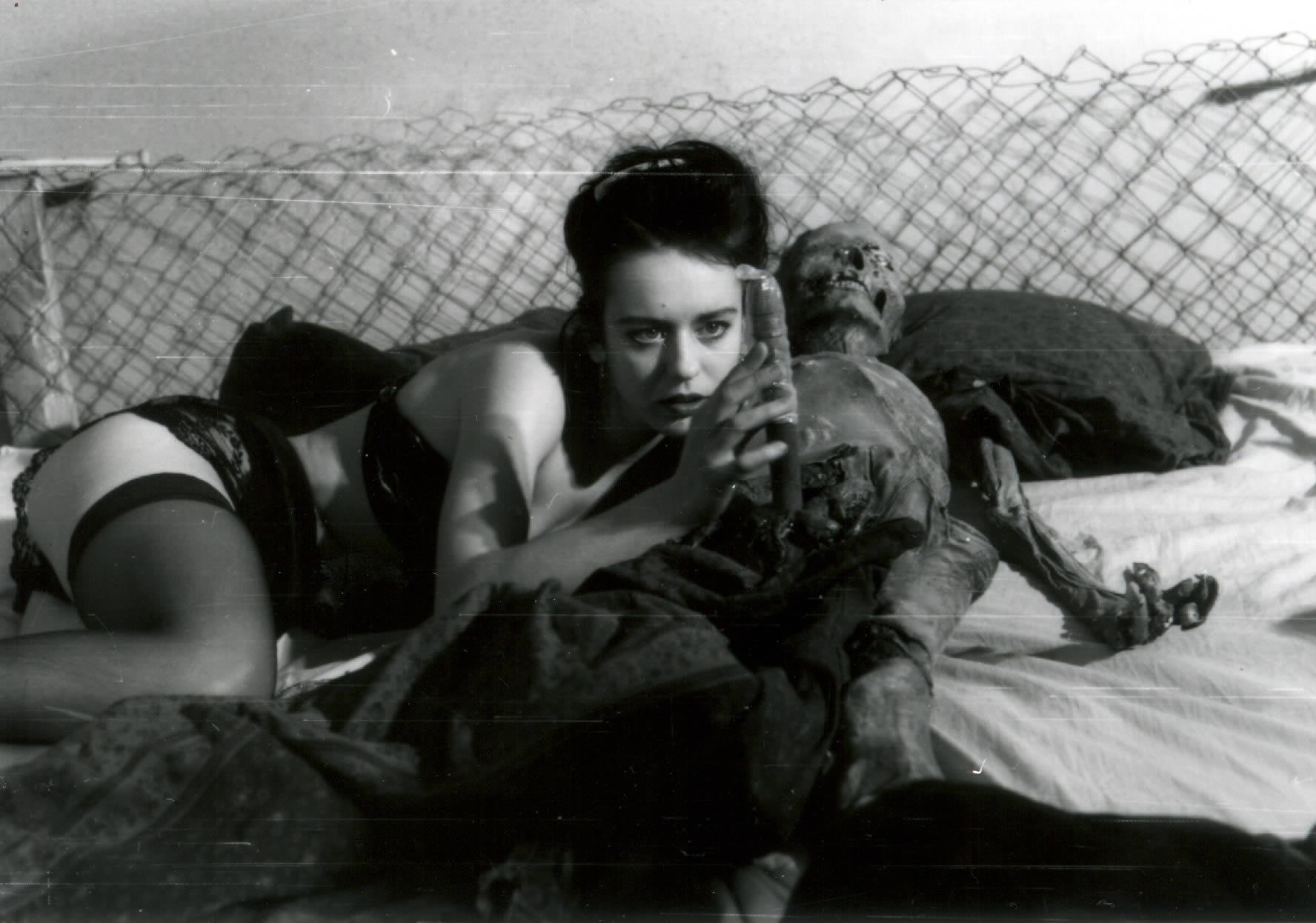 woman with corpse on bed in Nekromantik 