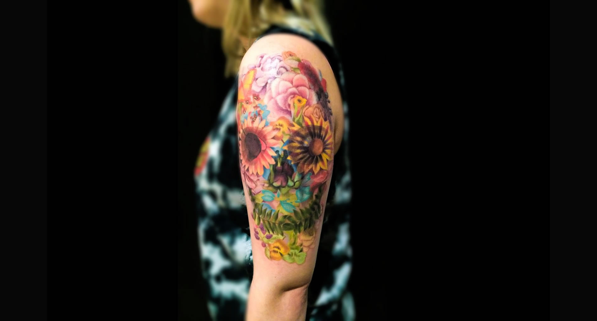 skull flower tattoo on arm