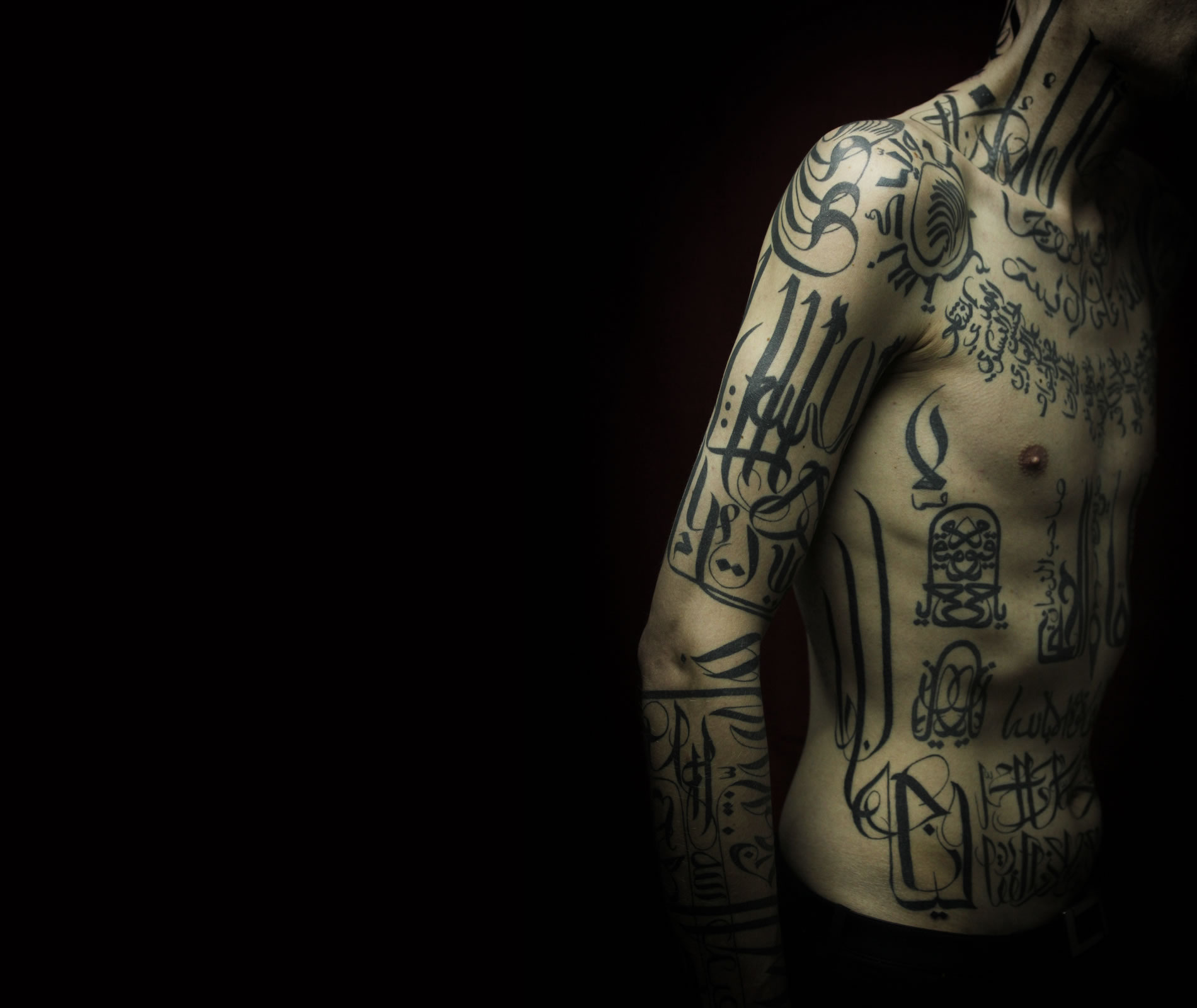 calligraphy lettering tattoo, blackwork on body