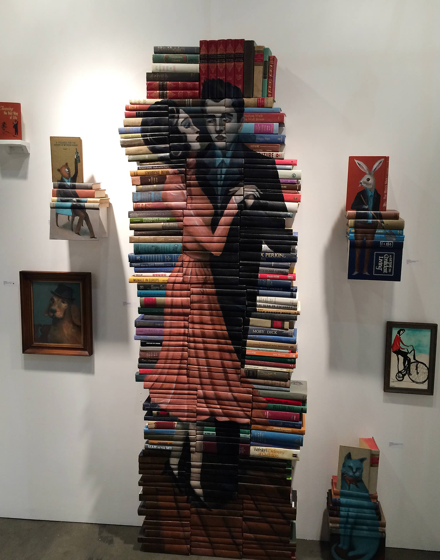 painting on book covers by mike stilkey