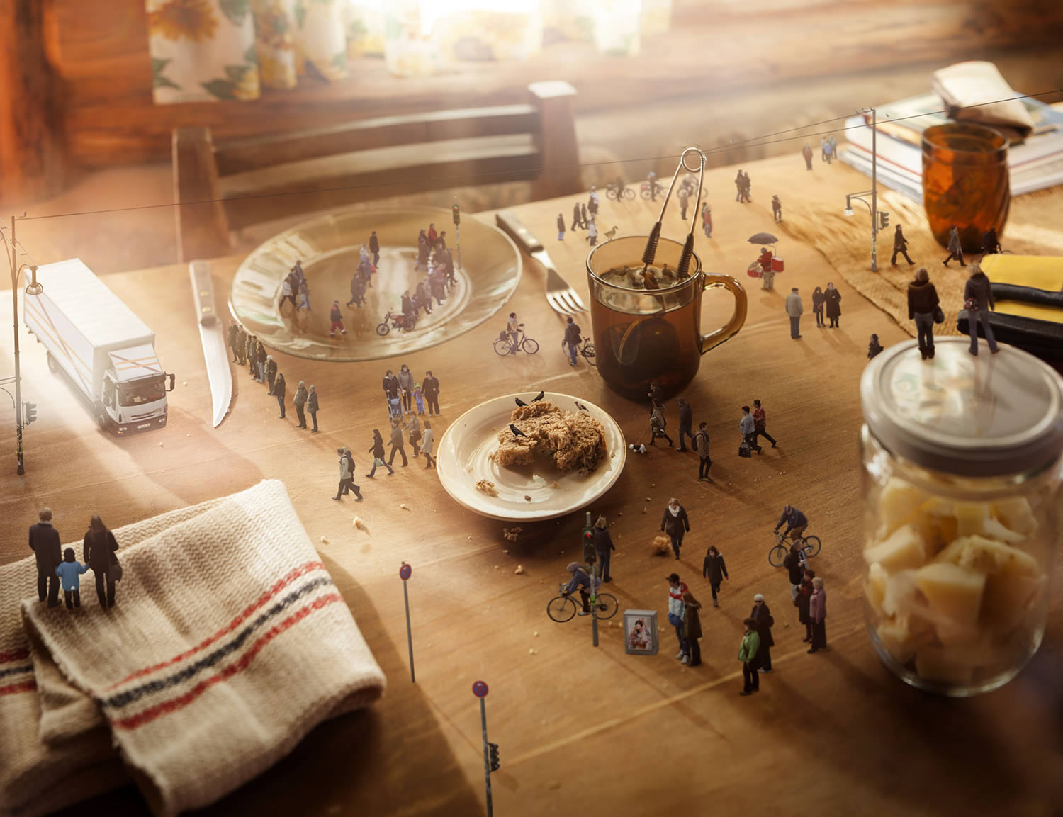 miniature people walking on kitchen table, by manuel archain