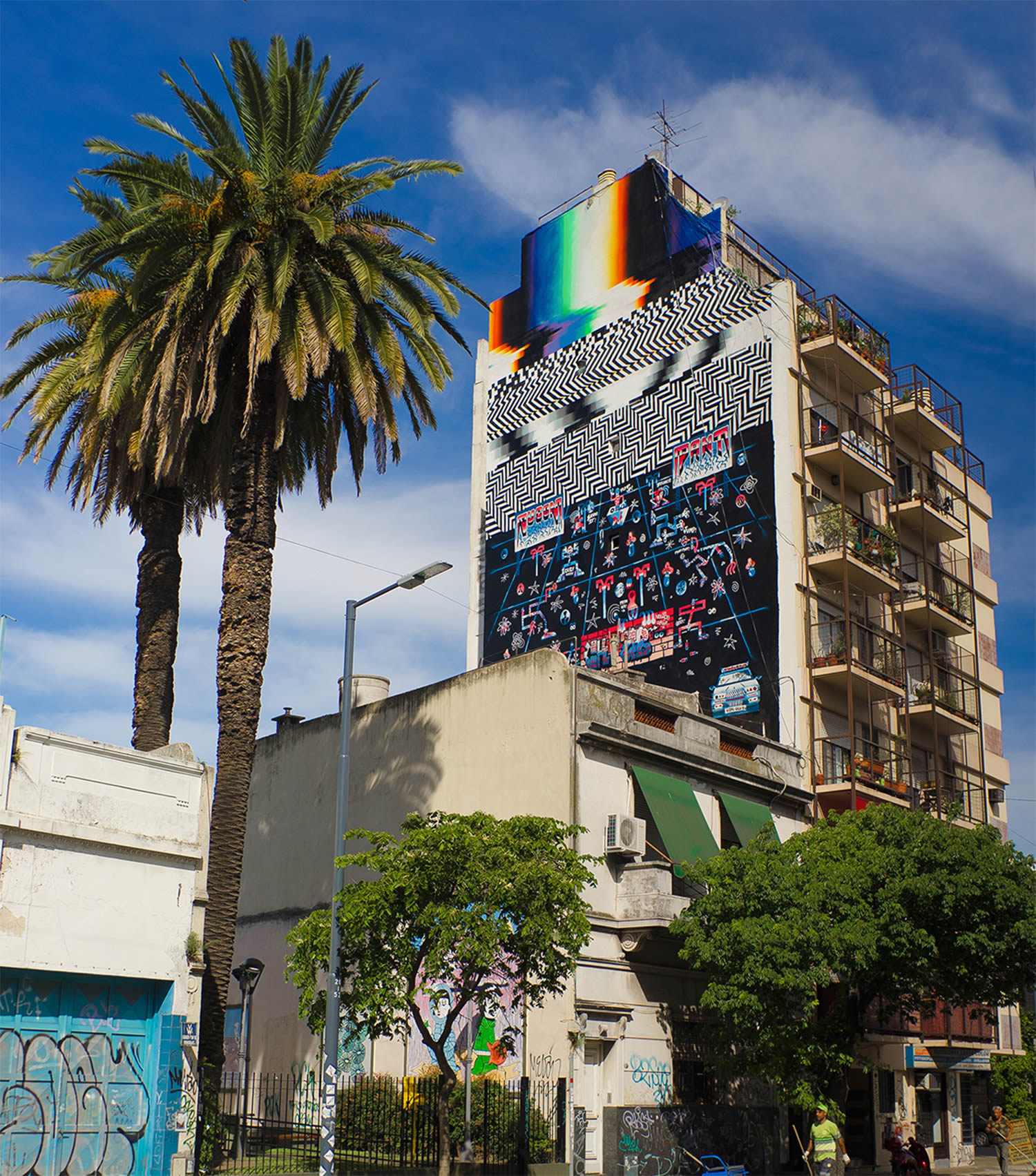 mural on large building in argentina, by pantone f