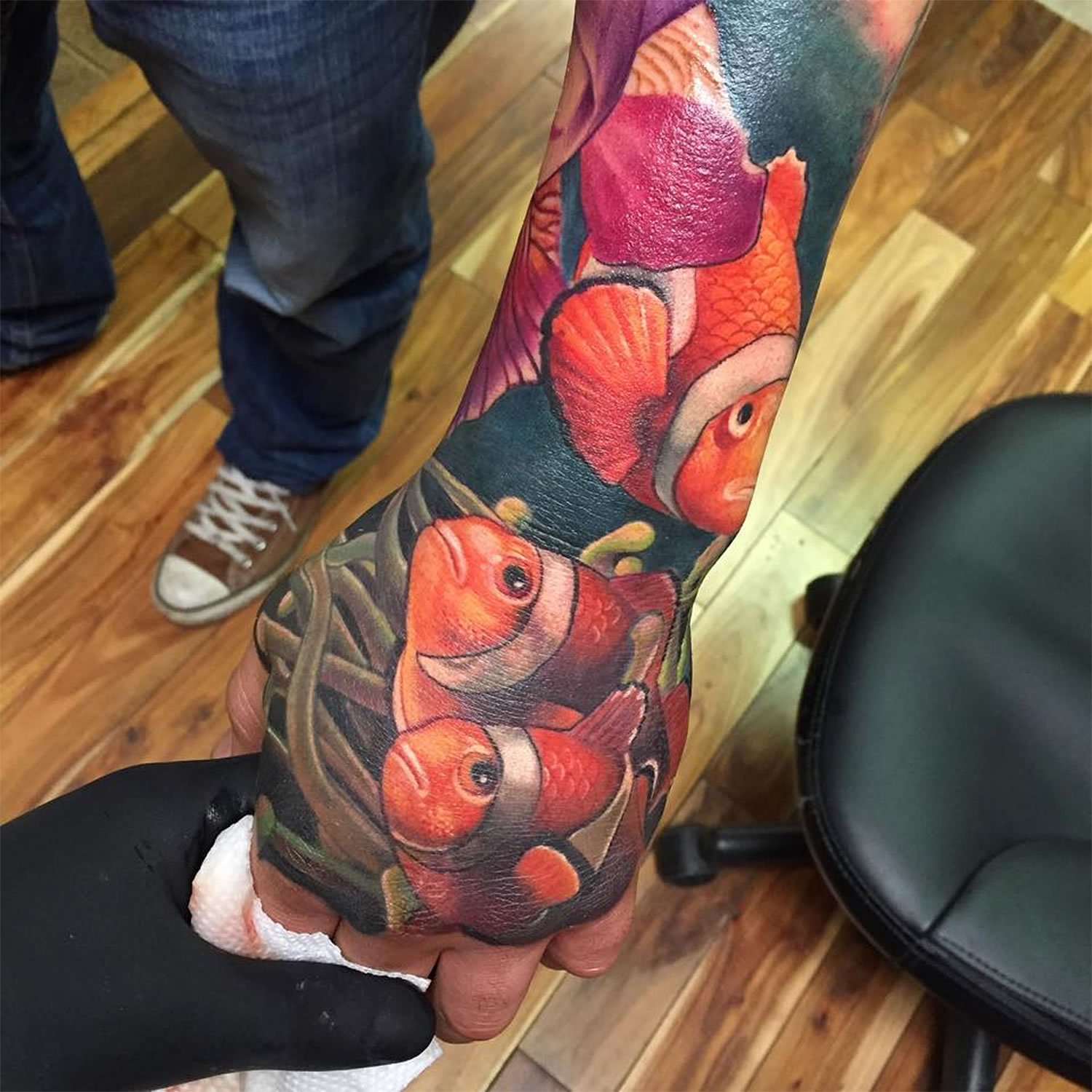 clown fish tattoo on hand by Josh payne