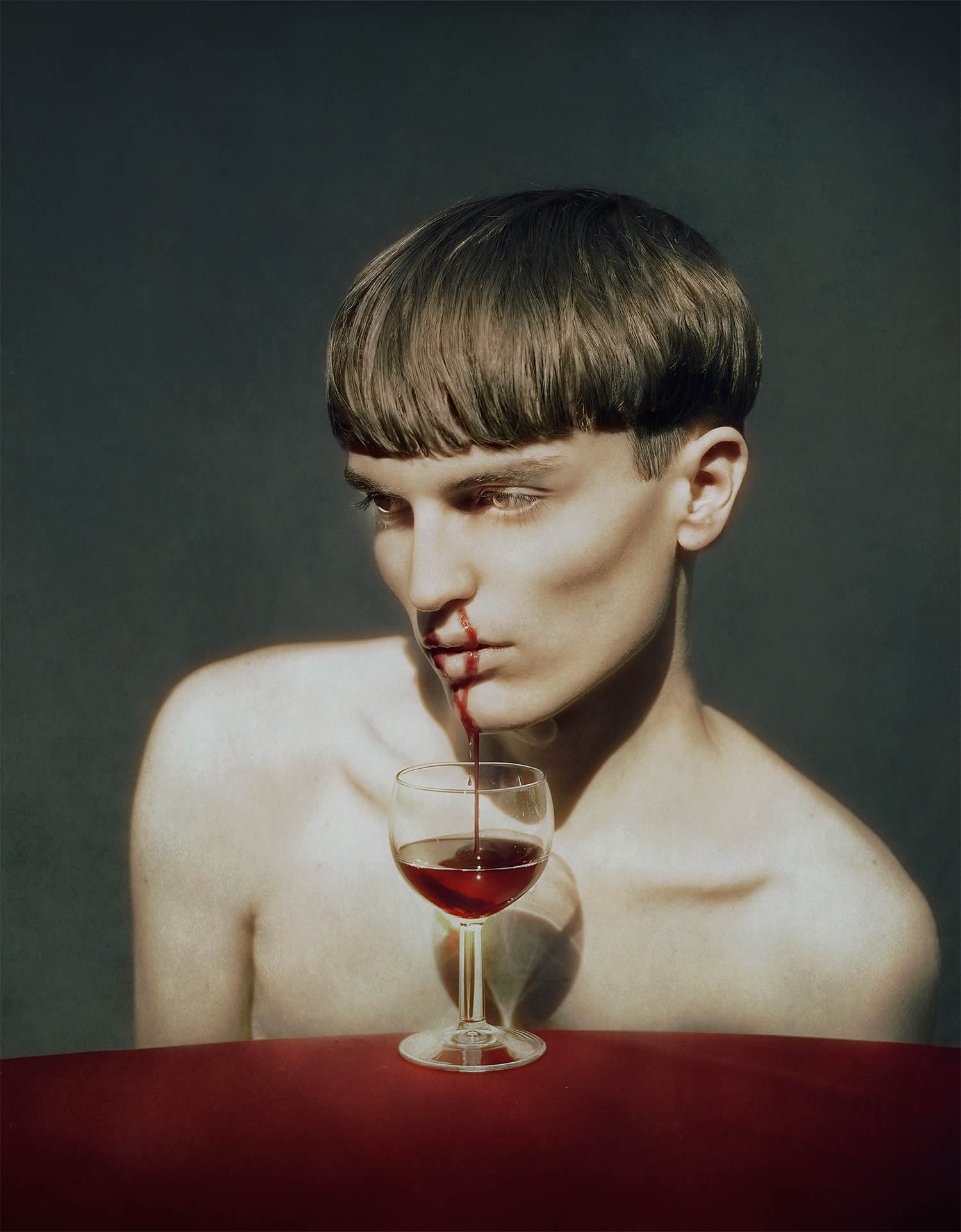 blood coming out of boy's nose to a glass wine, by Marwane Pallas