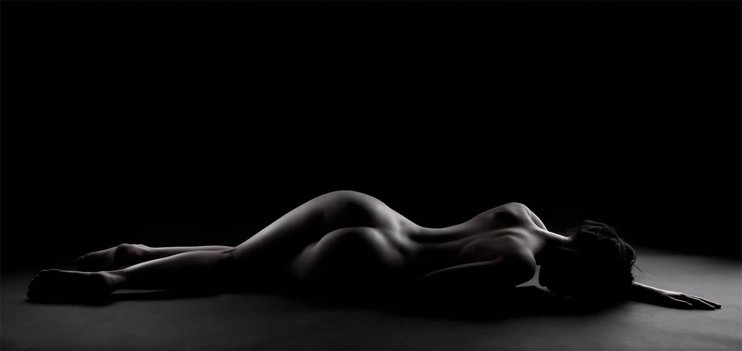 woman lying down, nude photo by joel bloch.