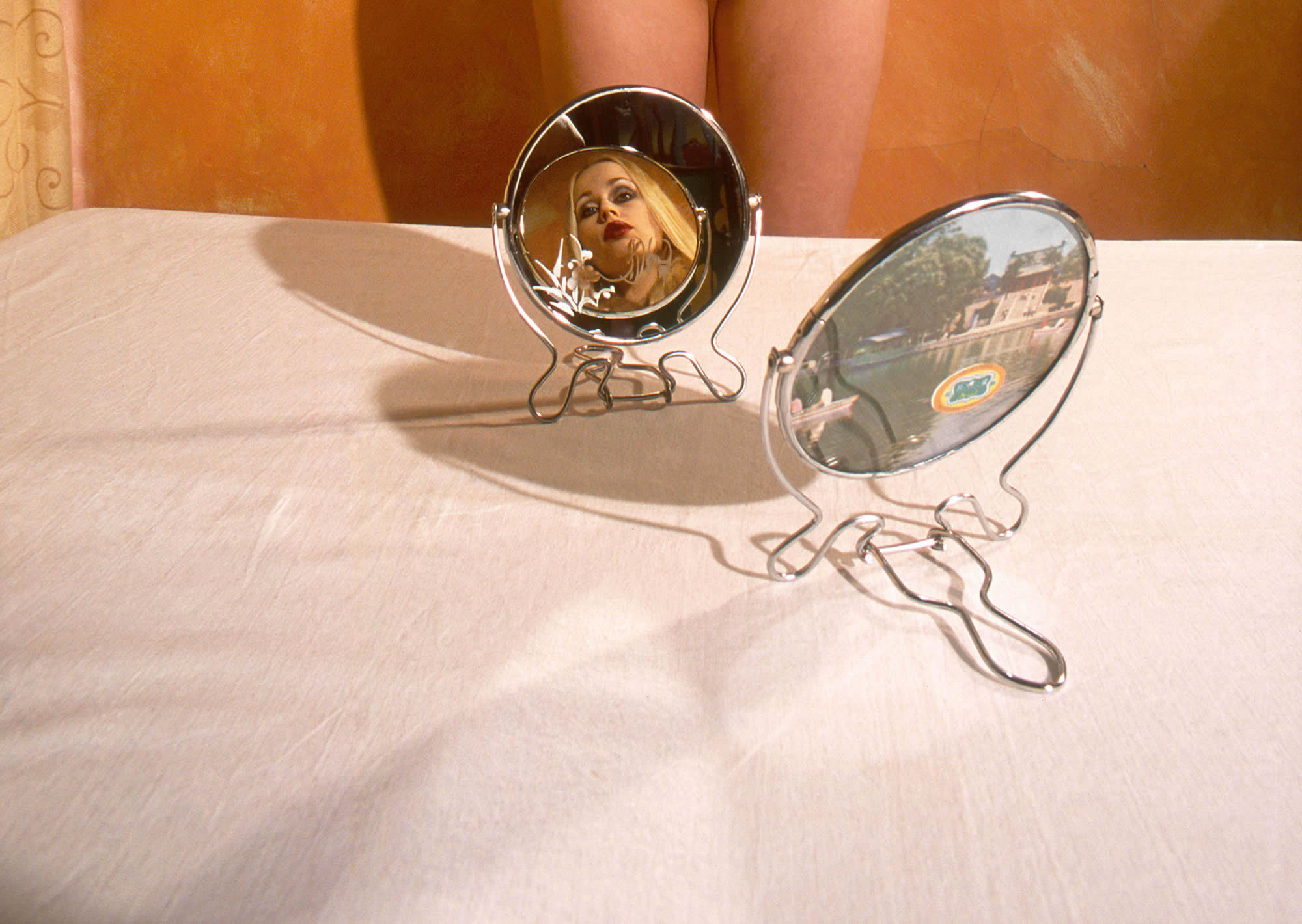 blonde woman in mirror