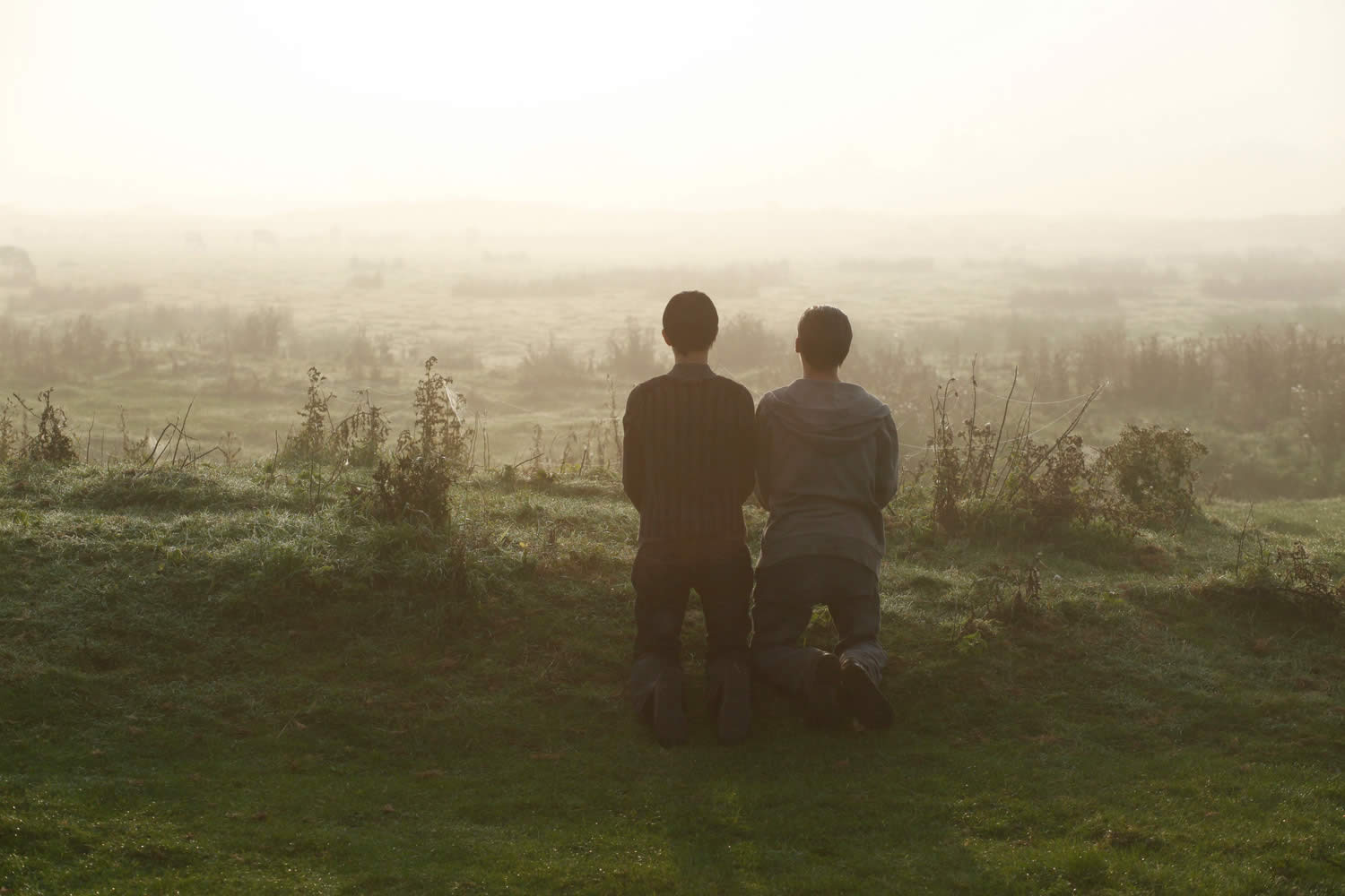 beautiful photo of field and two people in hors satan