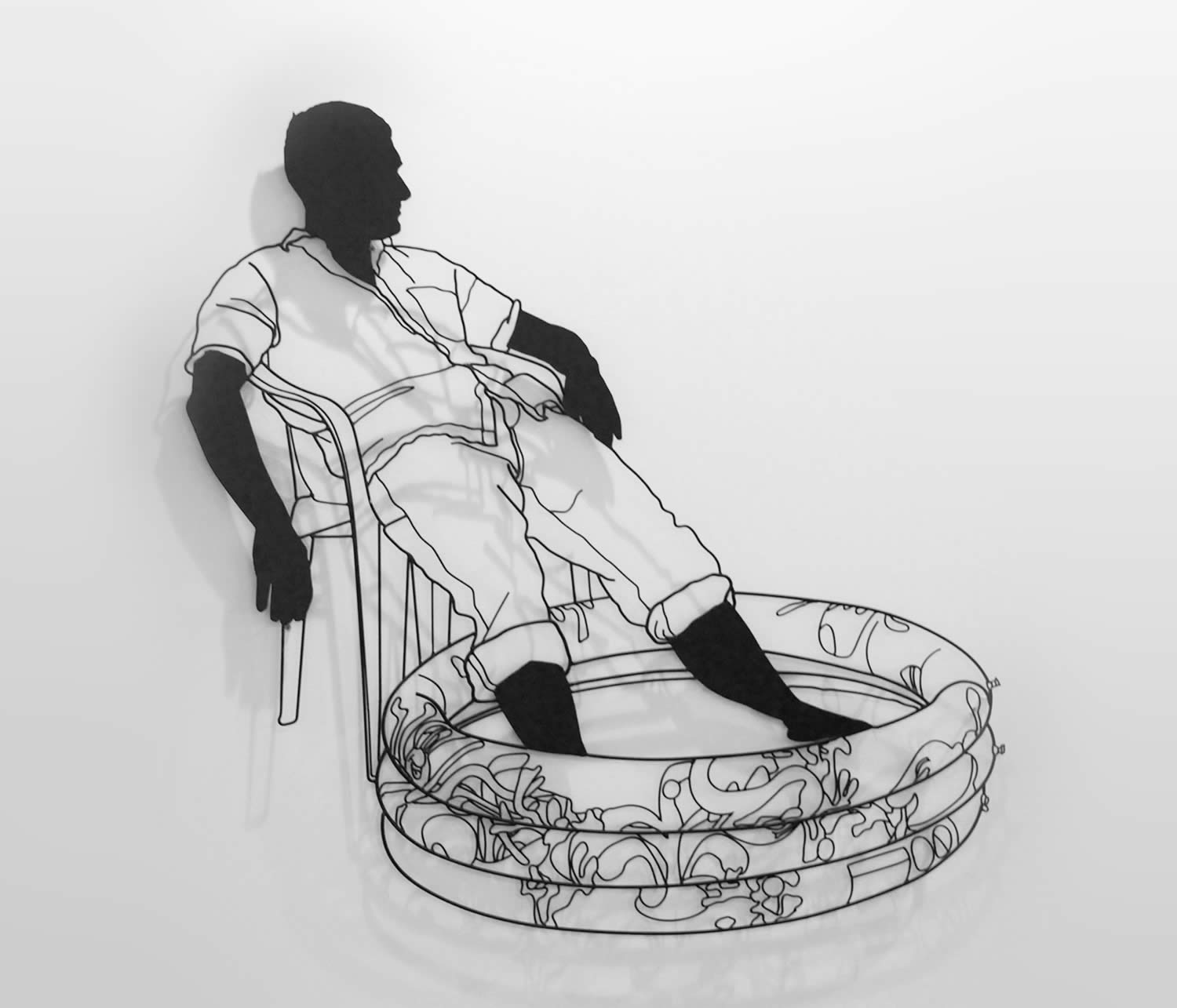 man wetting feet, sitting in chair, welding art by frank plant