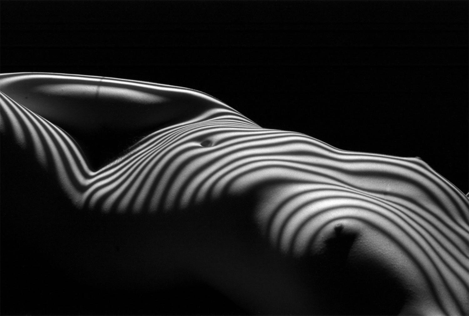 stripes on female body, photo by Lucien Clergue