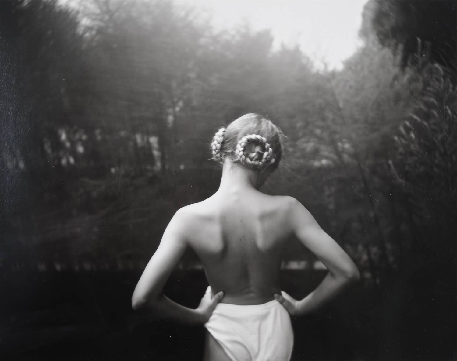 blond girl with black turned by sally mann