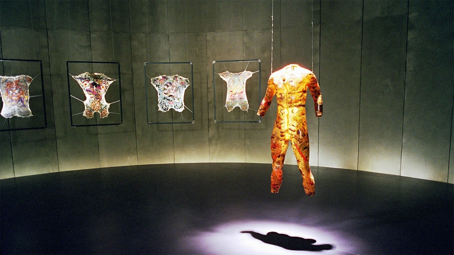 room with skins, and tattoos on those skins, tattoo 2002