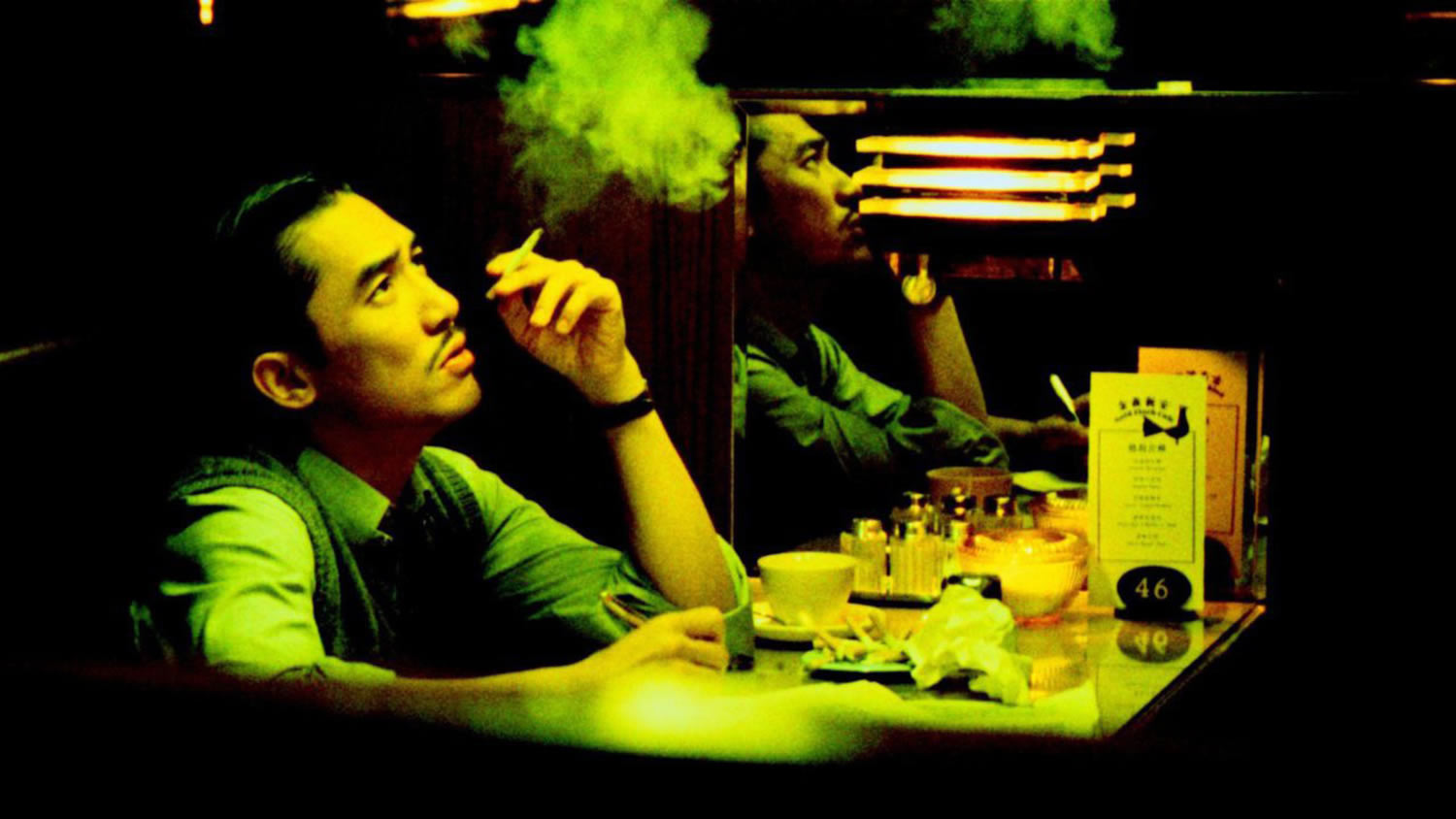 man smoking, yellow neon lighting, 2046 movie