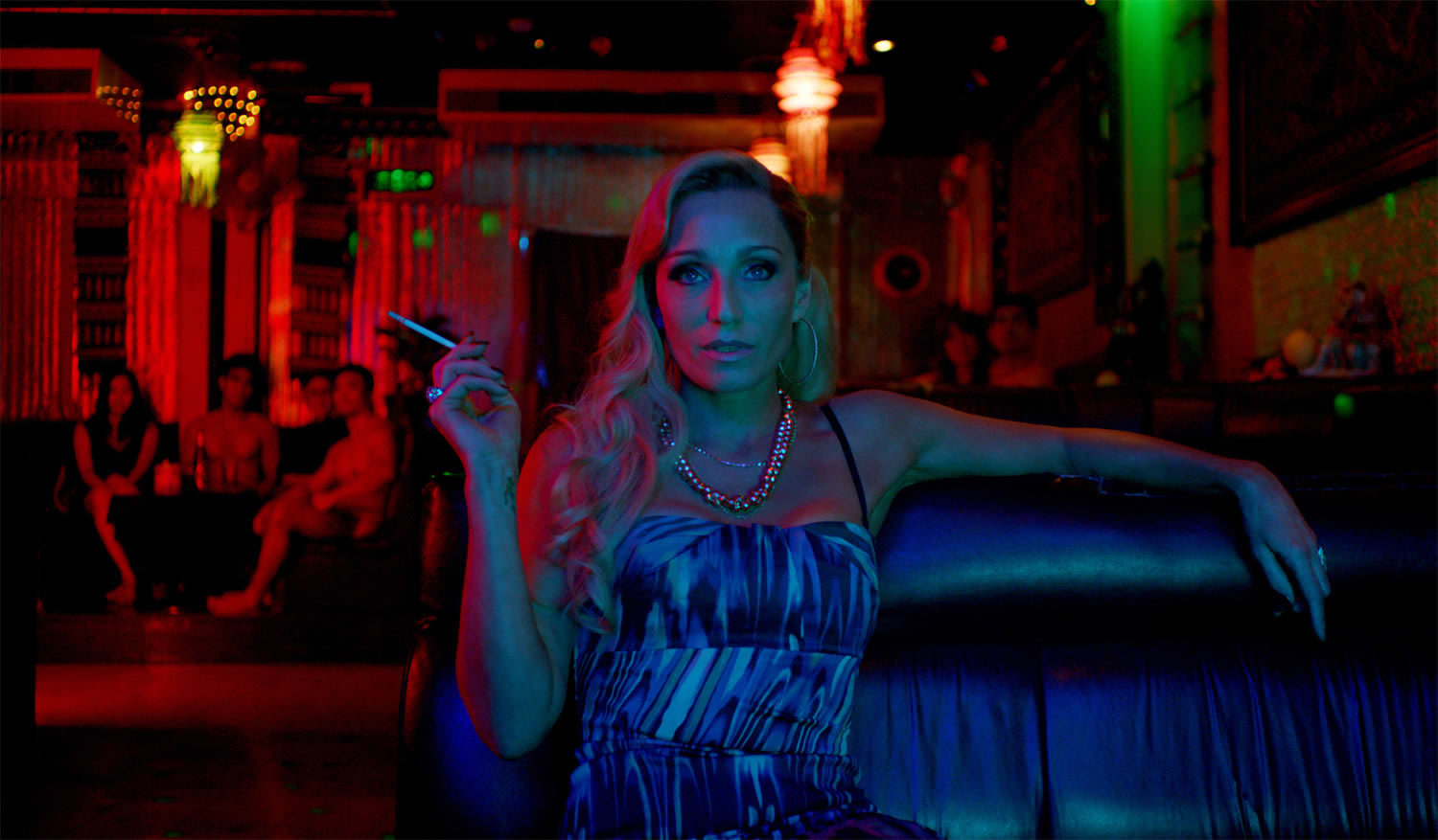 neon lights over kristen scott thomas in Only God Forgives