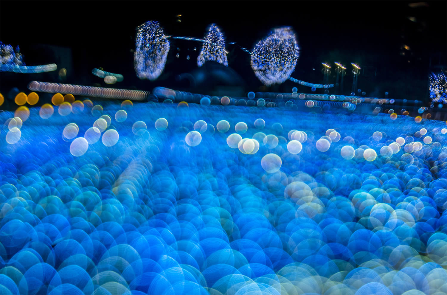 blue lights like sea, bokeh photography, japan, by Takashi Kitajima