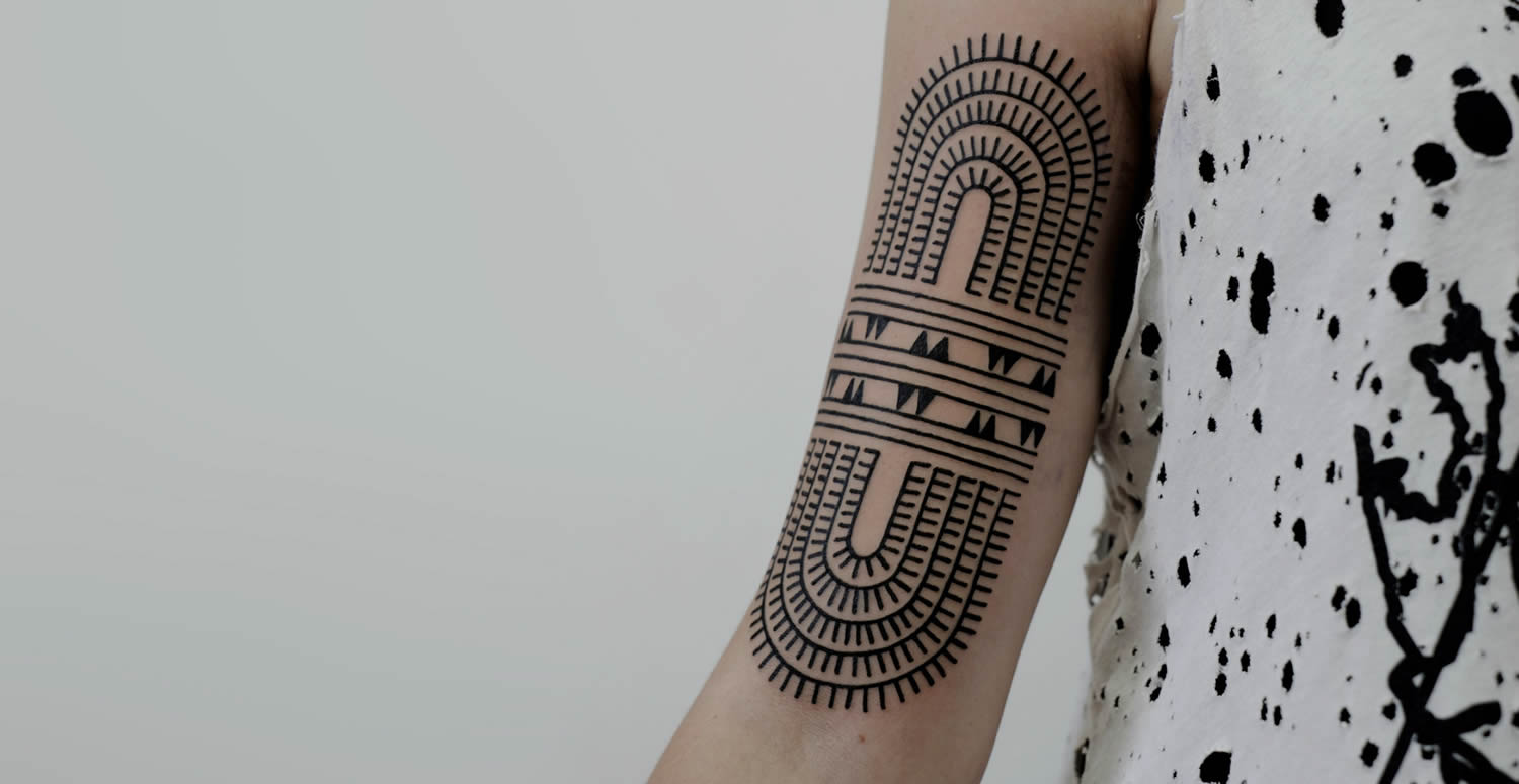 modern tribal on arm, tattoo by victor j webster