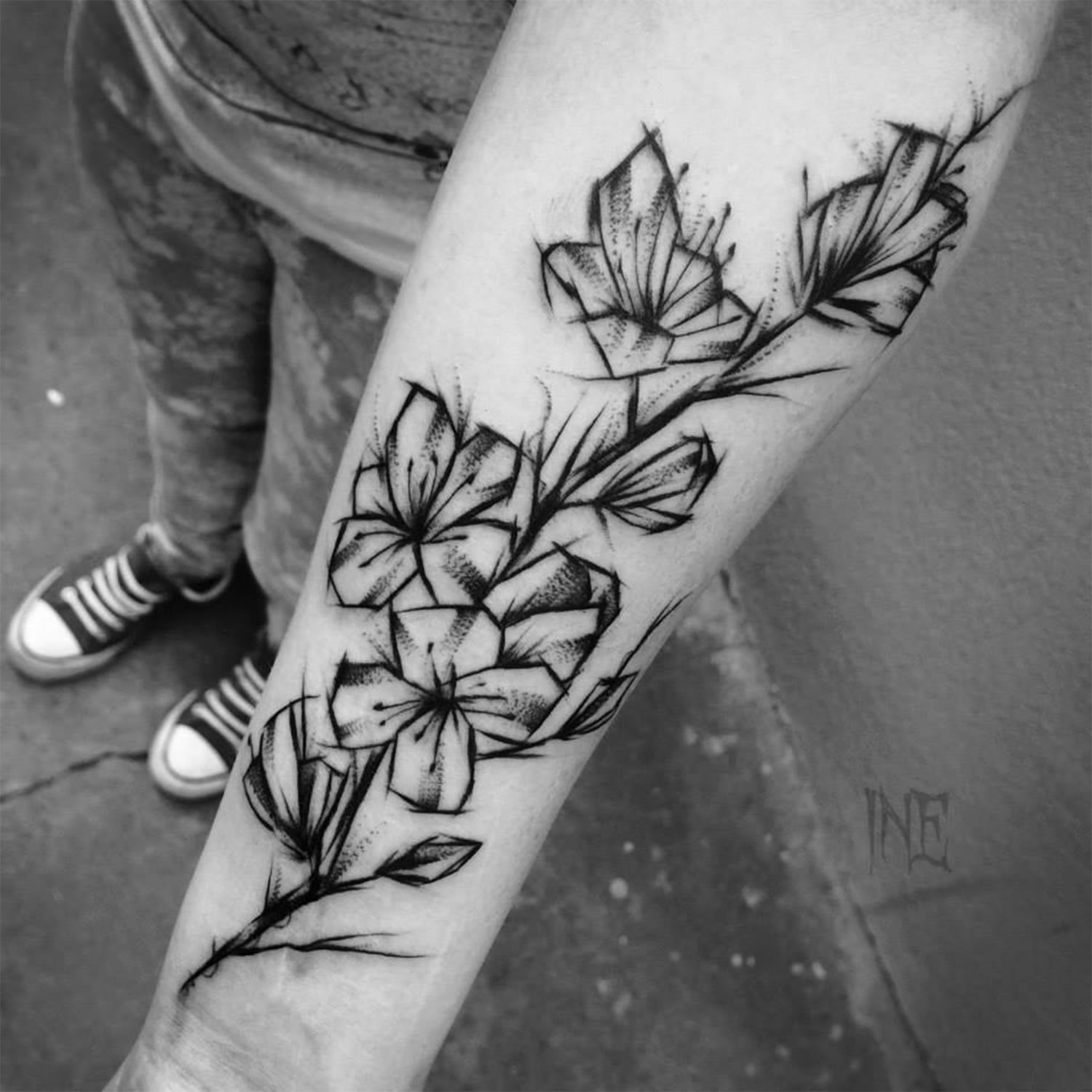 abstract flower tattoo on arm by inne