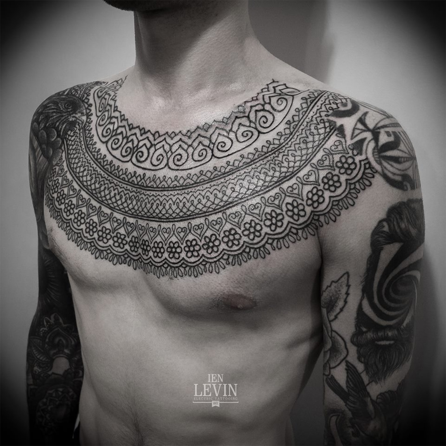 patterned chest tattoo by ien levin