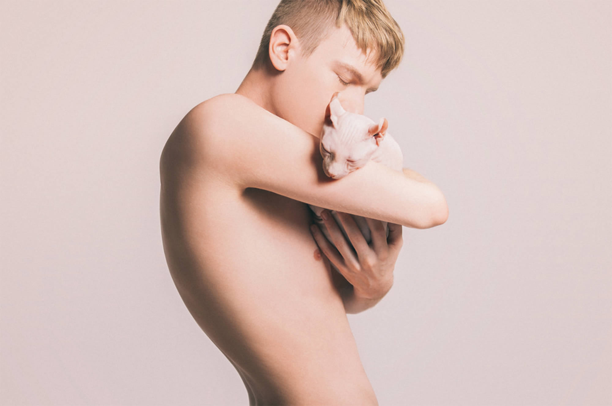 blonde man holding Sphynx, Celeste Martearena skin