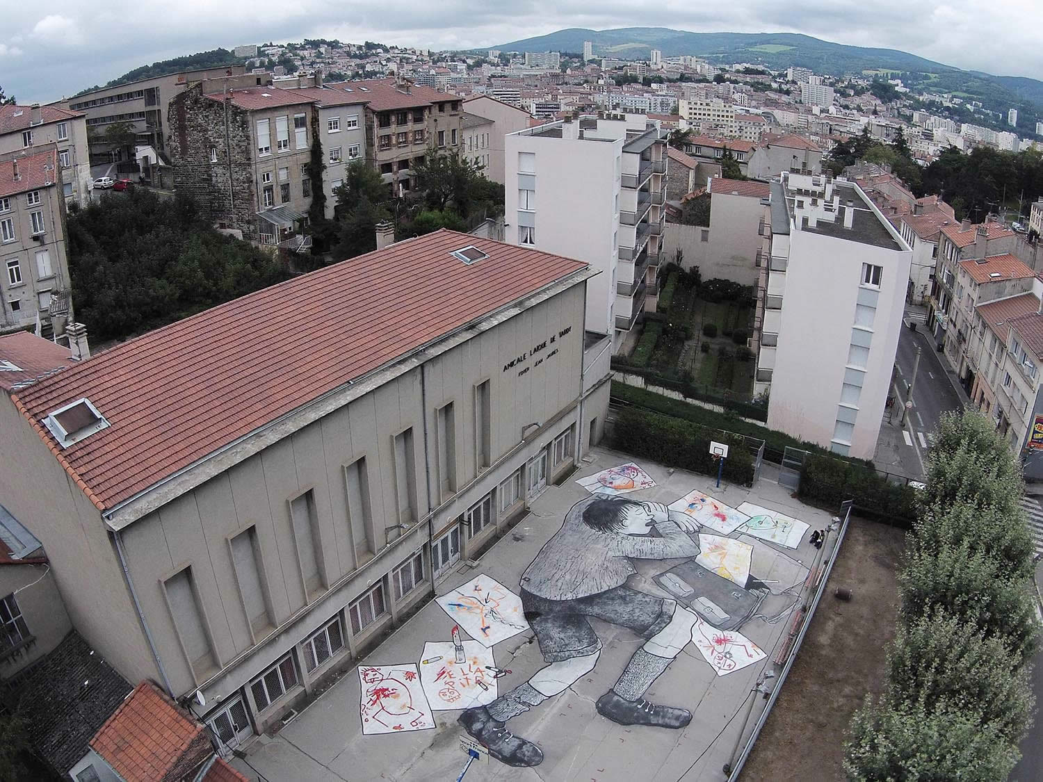 man playing cards, rooftop graffiti