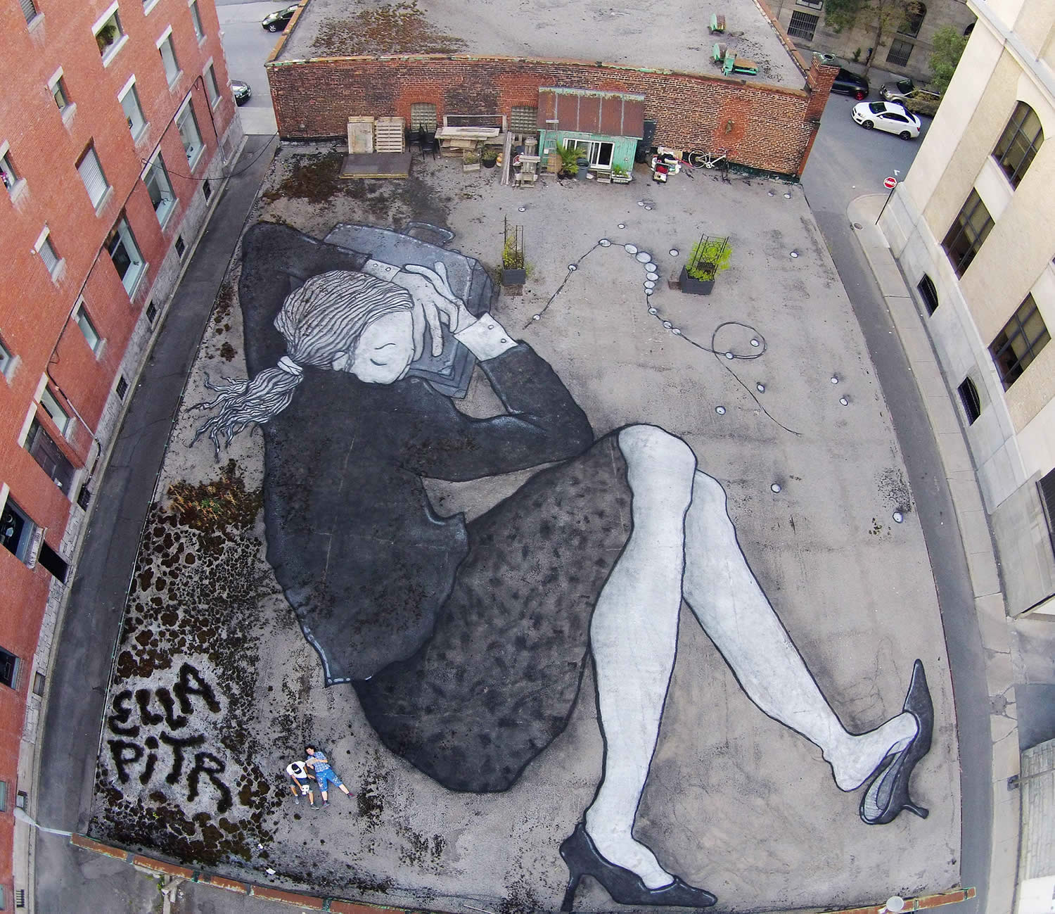 woman sleeping on rooftop, graffiti